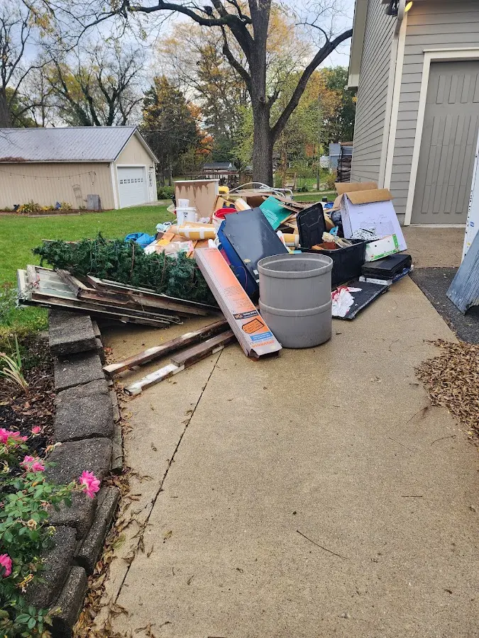 Dumpster being loaded with debris for 30 Yard Dumpster Rental in Spokane